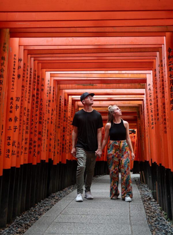 Me and my partner walking through Fushimi Inari Shrine in kyoto during our 10 day Japan itinerary.