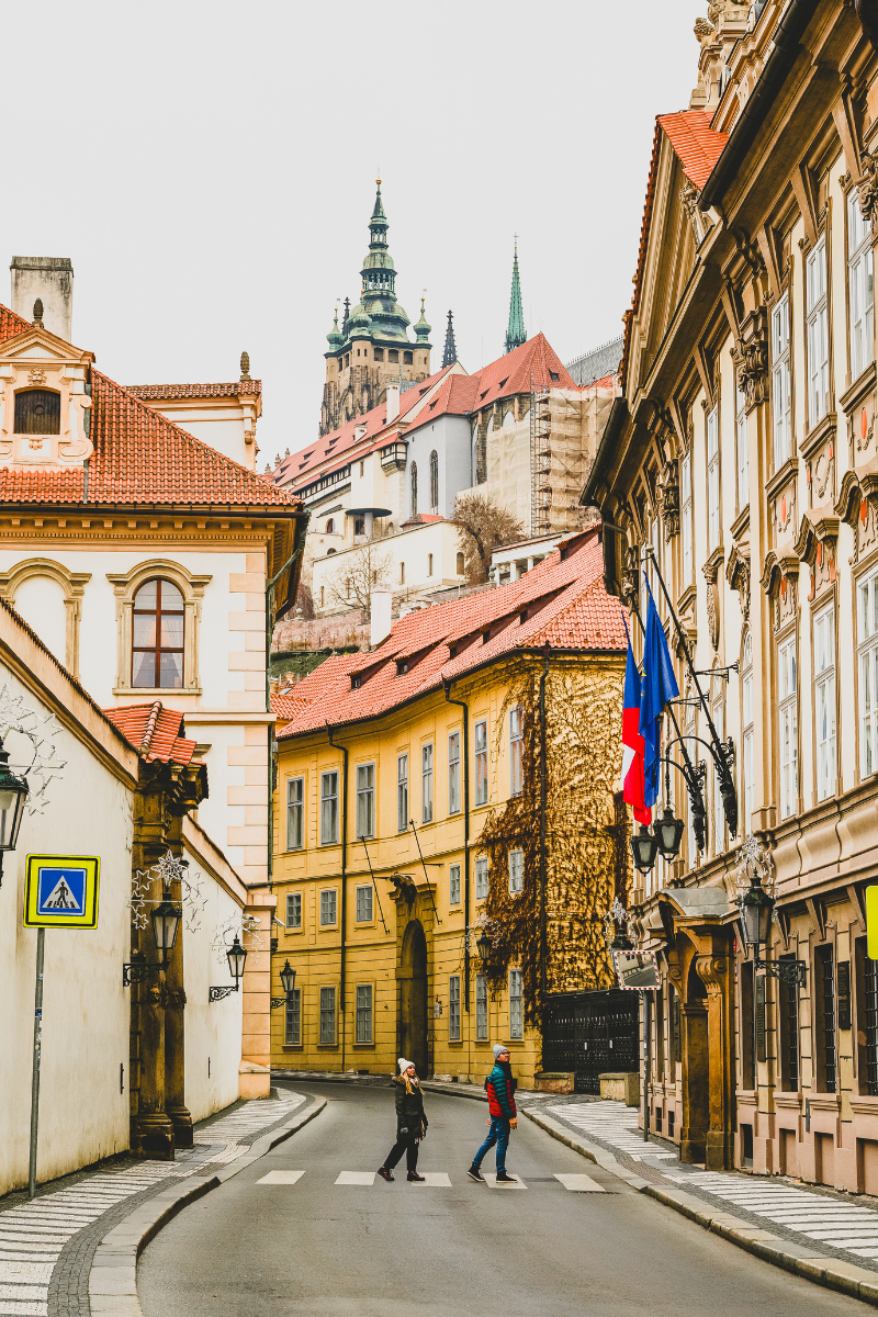 Jordyn and JT holding hands while crossing the street in prague.