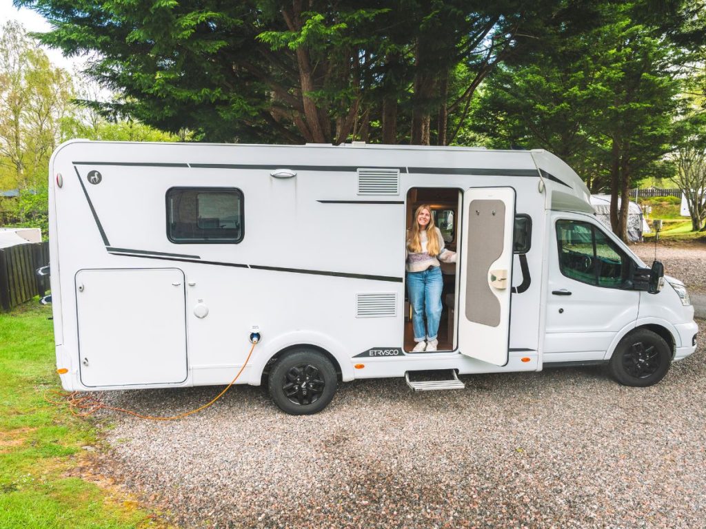 Me hanging outside of the motorhome that we rented for our Scottish Highlands Road Trip