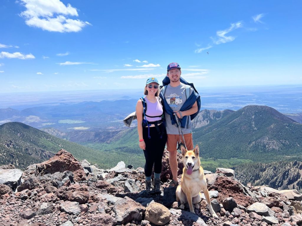 Jordyn and JT at the top of mount Humphreys with their dog Rizzo on their Arizona Road Trip