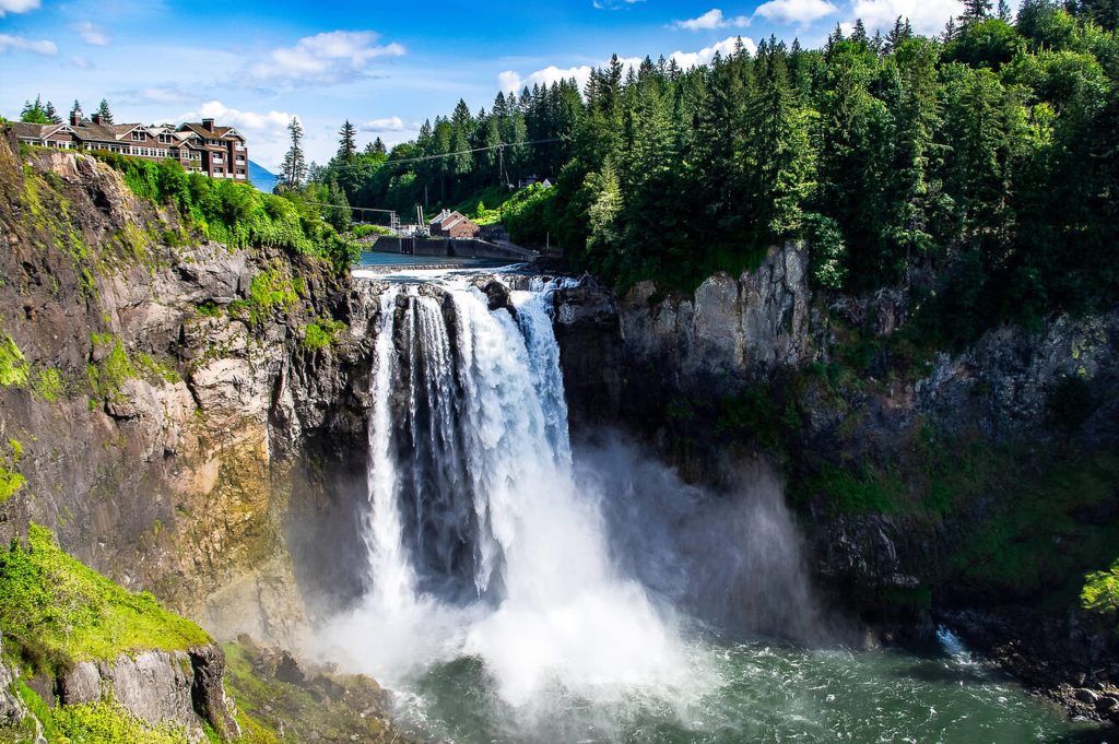 Epic view of Snoqualmie Falls cascading into the river gorge — a stunning day trip from Seattle featured in this Seattle travel guide.