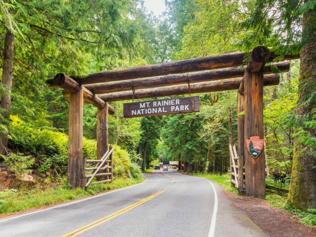 Entrance sign at Mount Rainier National Park surrounded by forest, marking the start of a Mount Rainier 2 day itinerary.