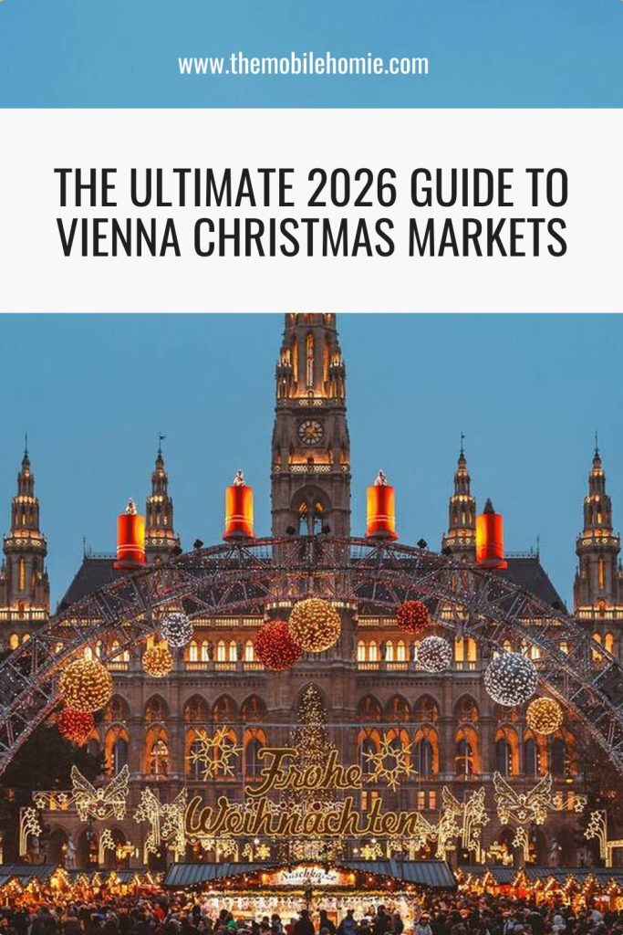 Blog graphic with the title “The Ultimate 2026 Guide to Vienna Christmas Markets” over a photo of Vienna’s Rathausplatz at dusk, with the Rathaus and festive “Frohe Weihnachten” arch in view.