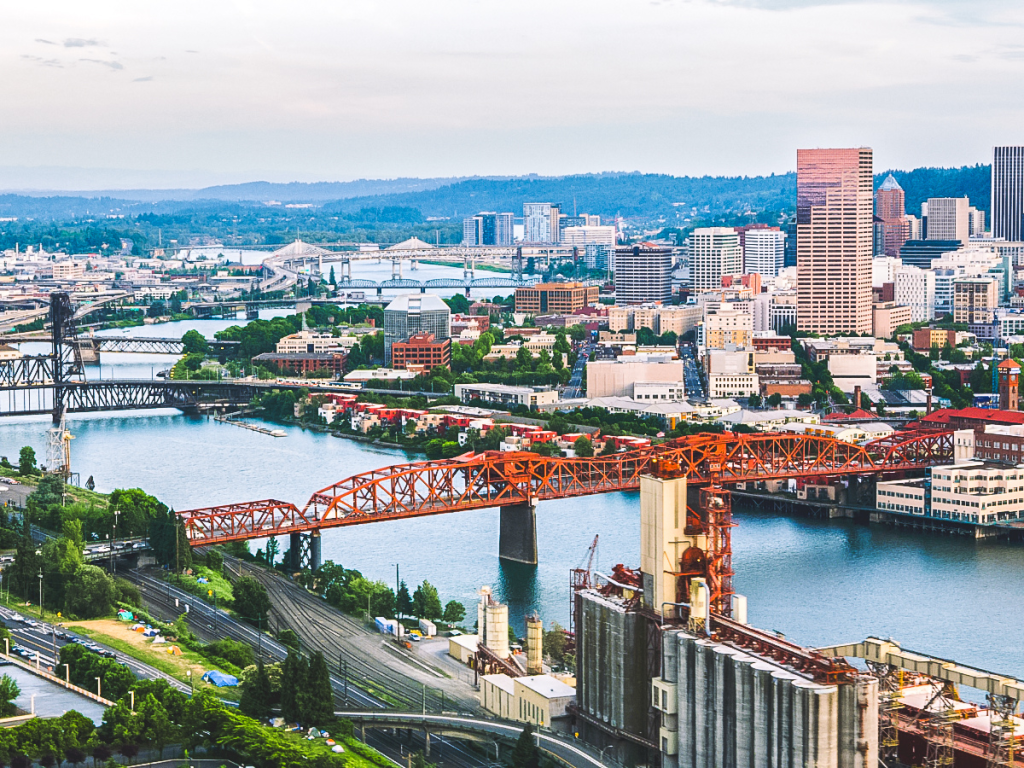 Aerial view of downtown Portland Oregon skyline with the Hawthorne Bridge crossing the Willamette River