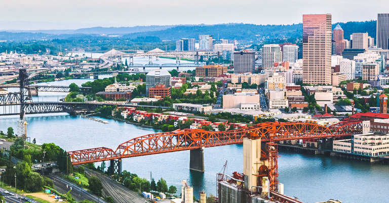 Aerial view of downtown Portland Oregon skyline with the Hawthorne Bridge crossing the Willamette River