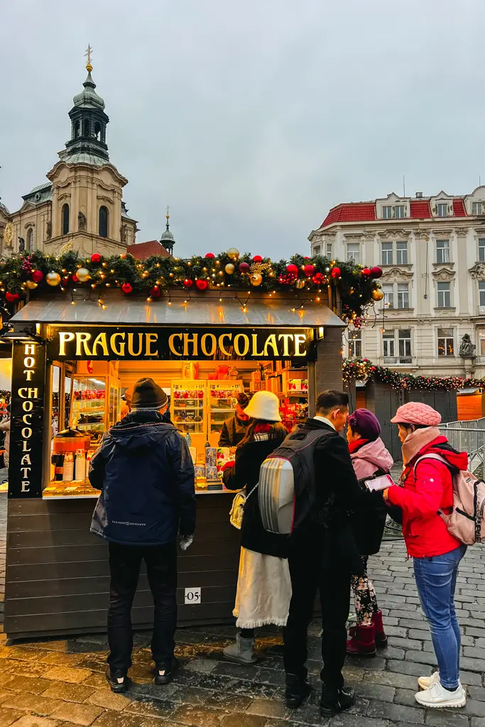 Prague Chocolate stall decorated for Christmas and selling hot chocolate and chocolate treats in Prague's historic Old Town.